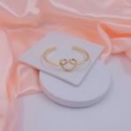 Infinity Knot Adjustable Stainless Steel Cuff Bracelet – Gold Finish