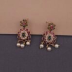 Khianaa temple necklace set displayed on bust with matching studs green pink pearls brass finish