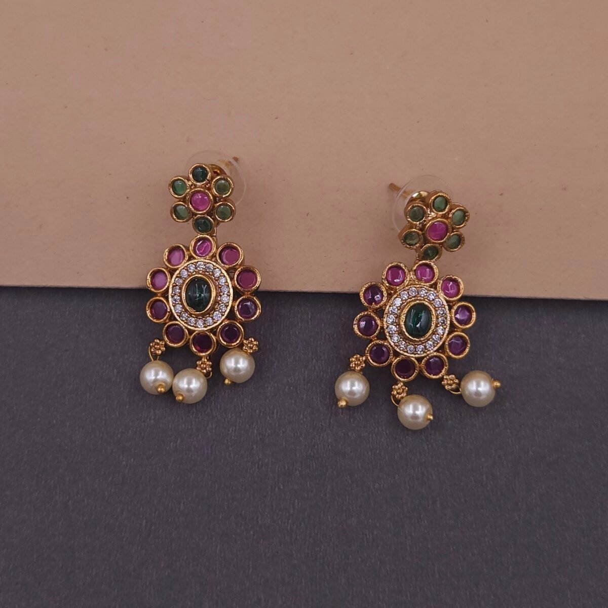 Khianaa temple necklace set displayed on bust with matching studs green pink pearls brass finish