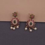 Khianaa temple necklace set displayed on bust with matching studs green pink pearls brass finish