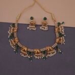 Khianaa elephant temple jewelry necklace set on mannequin with pearl and green stone drops