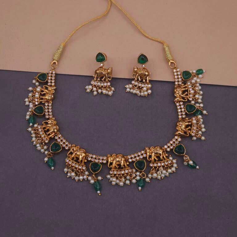 Khianaa elephant temple jewelry necklace set on mannequin with pearl and green stone drops